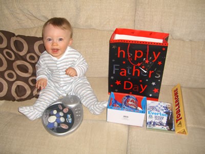 Ben sat next to my Father's Day presents (and my finger drums)