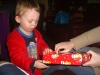 Ben opening a present.