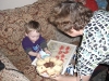 Ben eating cake and biscuits.