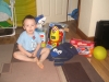 Ben sat with his opened presents.