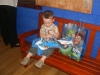 Opening more presents at his party.