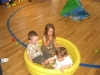 Ben, Ella and Laura in the ball pool with no balls.