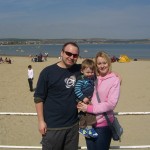 All of us posing in front of the beach at Weymouth